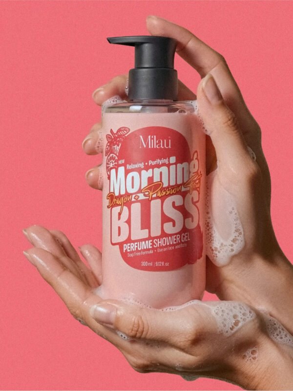 Hands lathering Milau Dragon Fruit & Passion Fruit perfume shower gel with foam